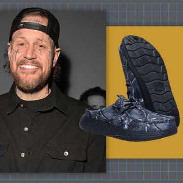 Fashionable shoes showcased in a promotional context with a blurred background figure. Fashionable shoes showcased in a promotional context with a blurred background figure.