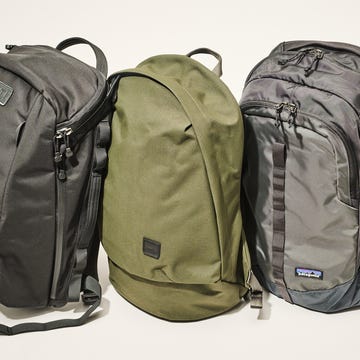 three backpacks of different designs and colors arranged closely three backpacks of different designs and colors arranged closely
