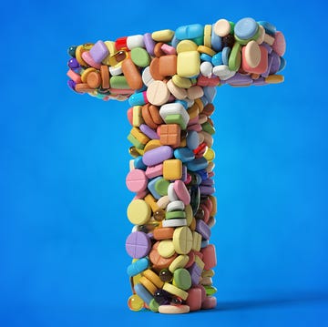 letter t composed of colorful pills and capsules