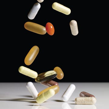 various supplements falling onto table toop