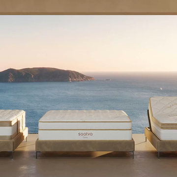 Three luxurious mattresses displayed with a scenic ocean view.